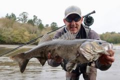 Trophy bass caught on a fly by the author